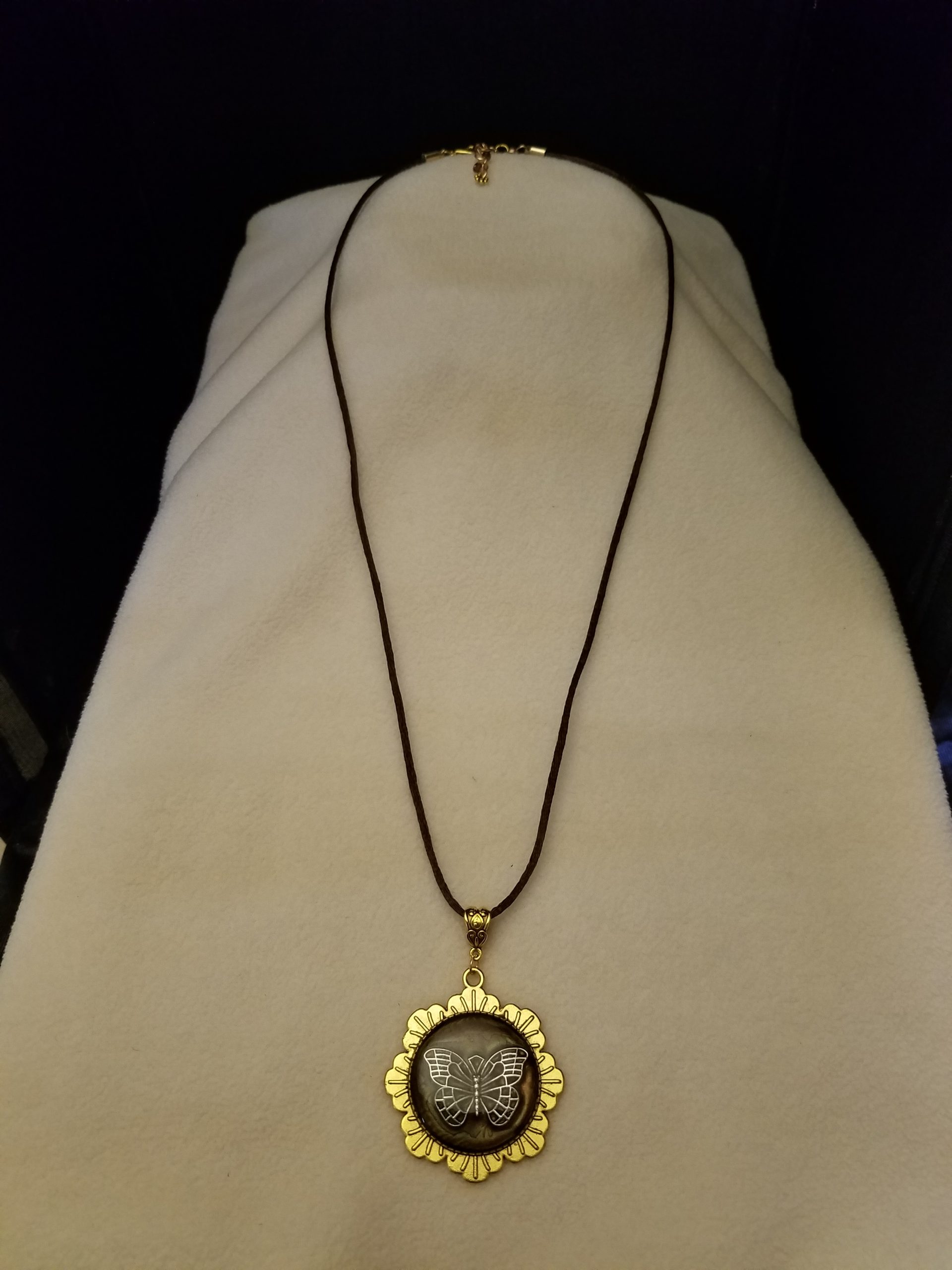 Brown Cord Adjustable Necklace with Silver Butterfly Set in Brown Epoxy on Gold Flower Pendant