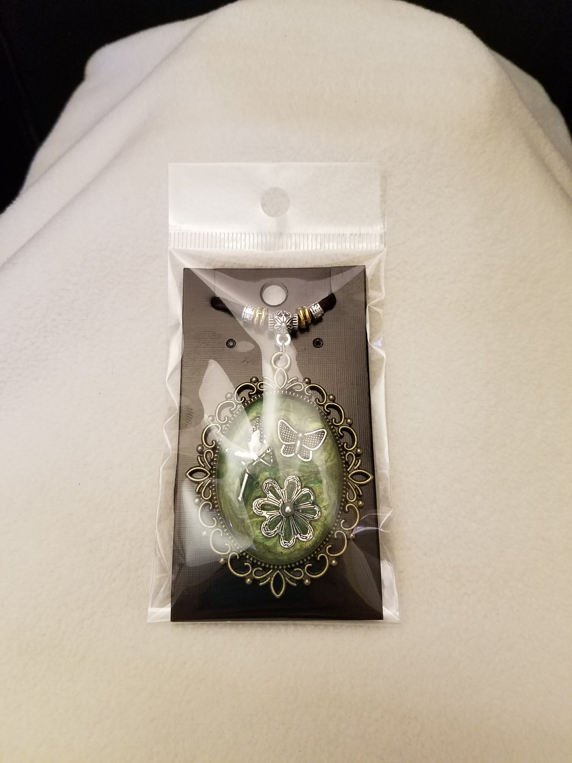 Brown Cord Beaded Adjustable Necklace with Silver Fairy, Butterfly & Flower Set in Green Epoxy on Decorative Antique Gold Pendant