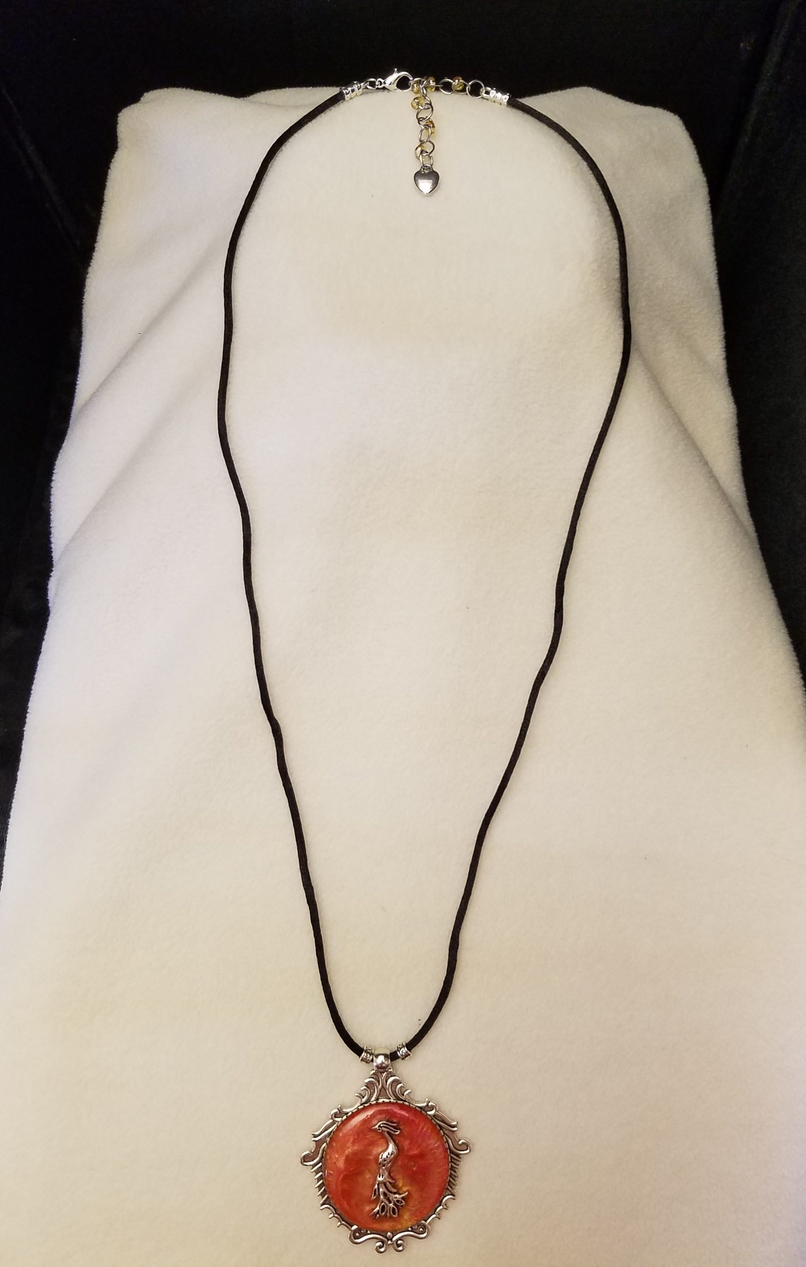 Black Cord Beaded Adjustable Necklace with Silver Phoenix Set in Orange Swirled Epoxy on Decorative Silver Pendant