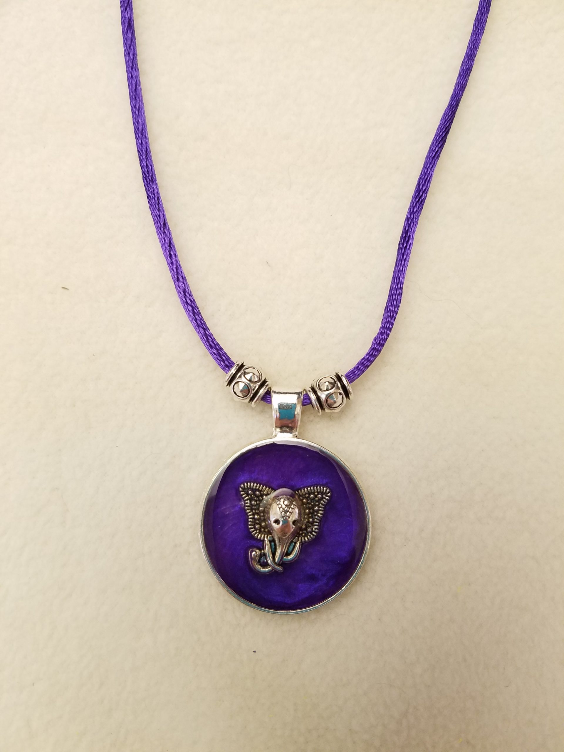 Silver Elephant in Purple Epoxy on Round Silver Pendant on Purple Cord Necklace