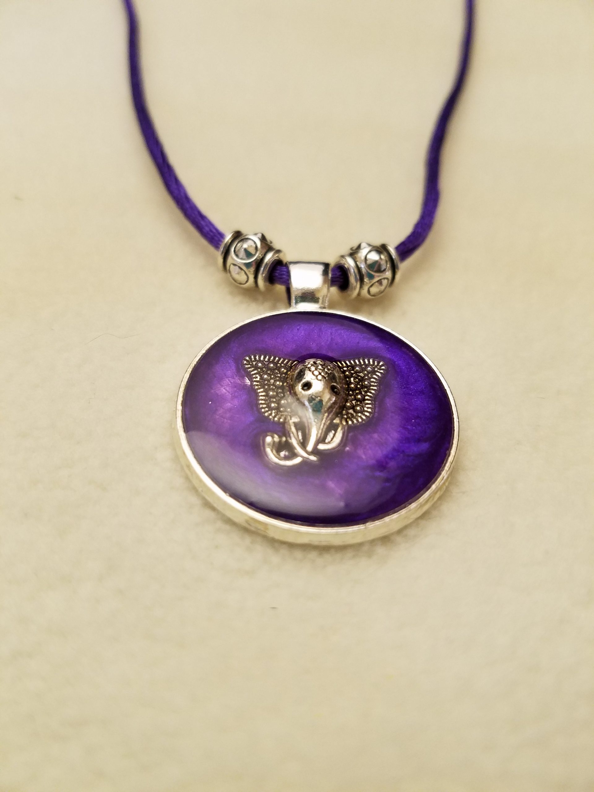 Silver Elephant in Purple Epoxy on Round Silver Pendant on Purple Cord Necklace