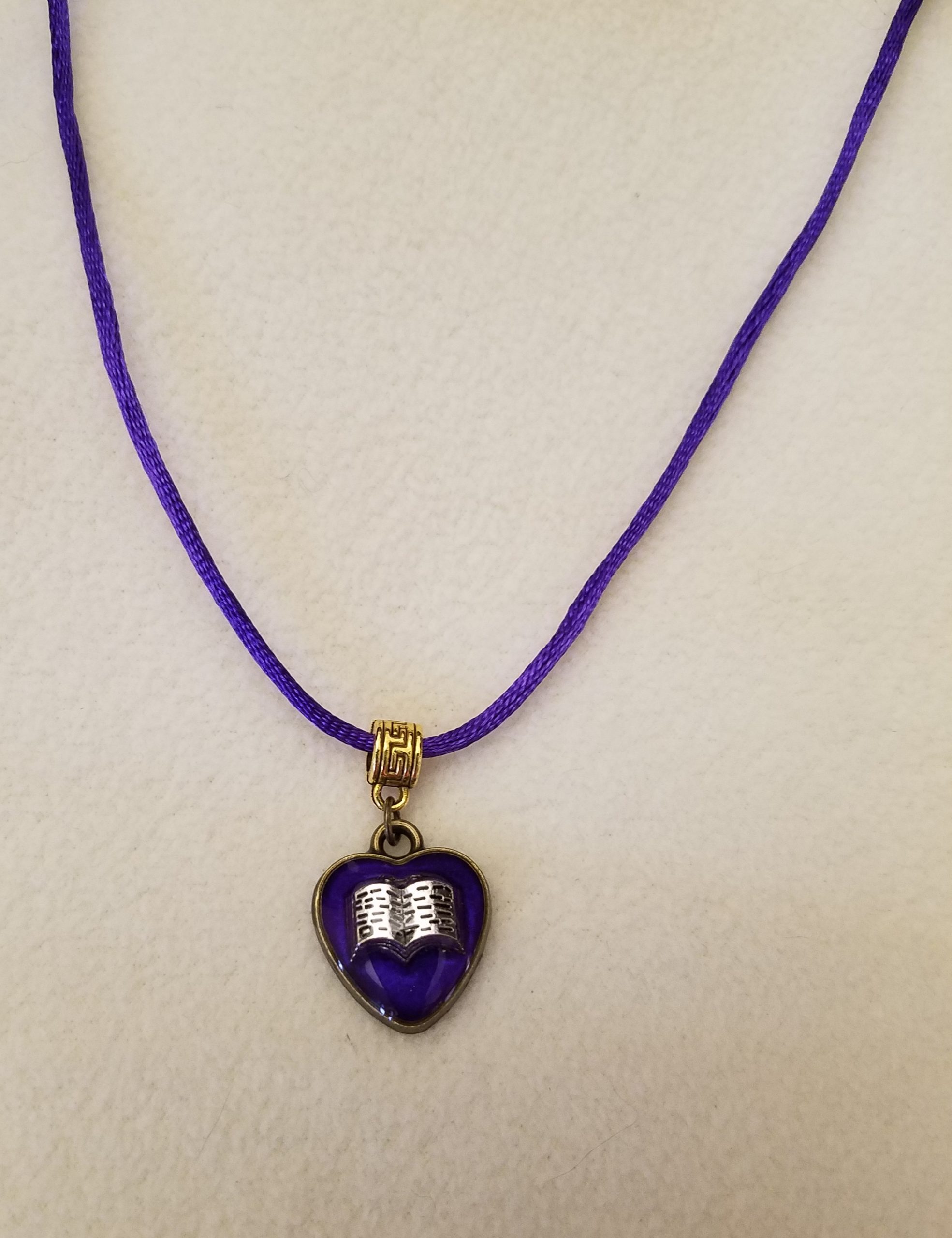 Black Cord Necklace with Purple Beaded Bronze Chain Adjustment with Silver Open Book Set in Purple Epoxy on a Bronze Heart Pendant