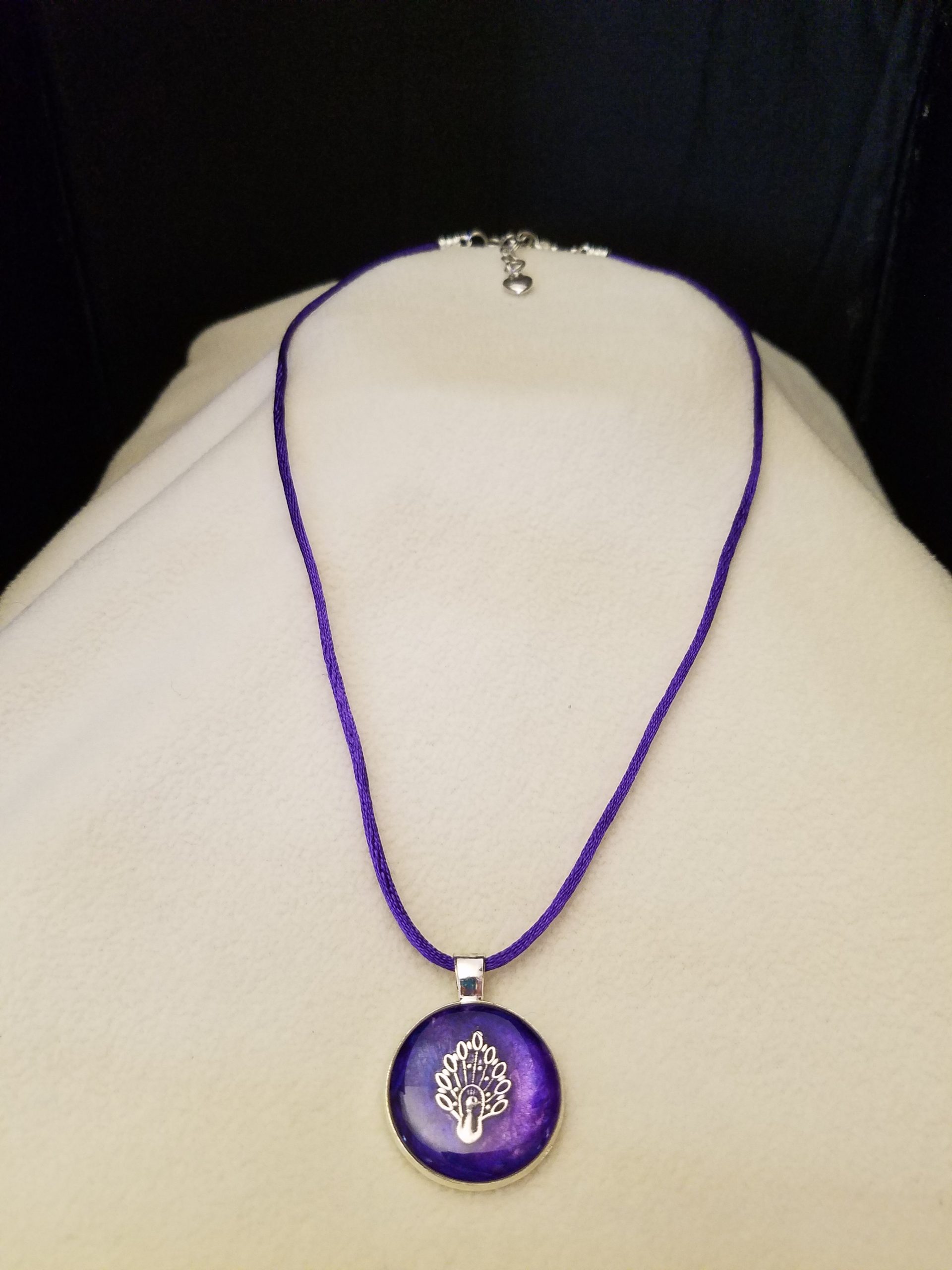 Adjustable Purple Cord Necklace with a Silver Peacock in Purple Epoxy on Round Silver Pendant