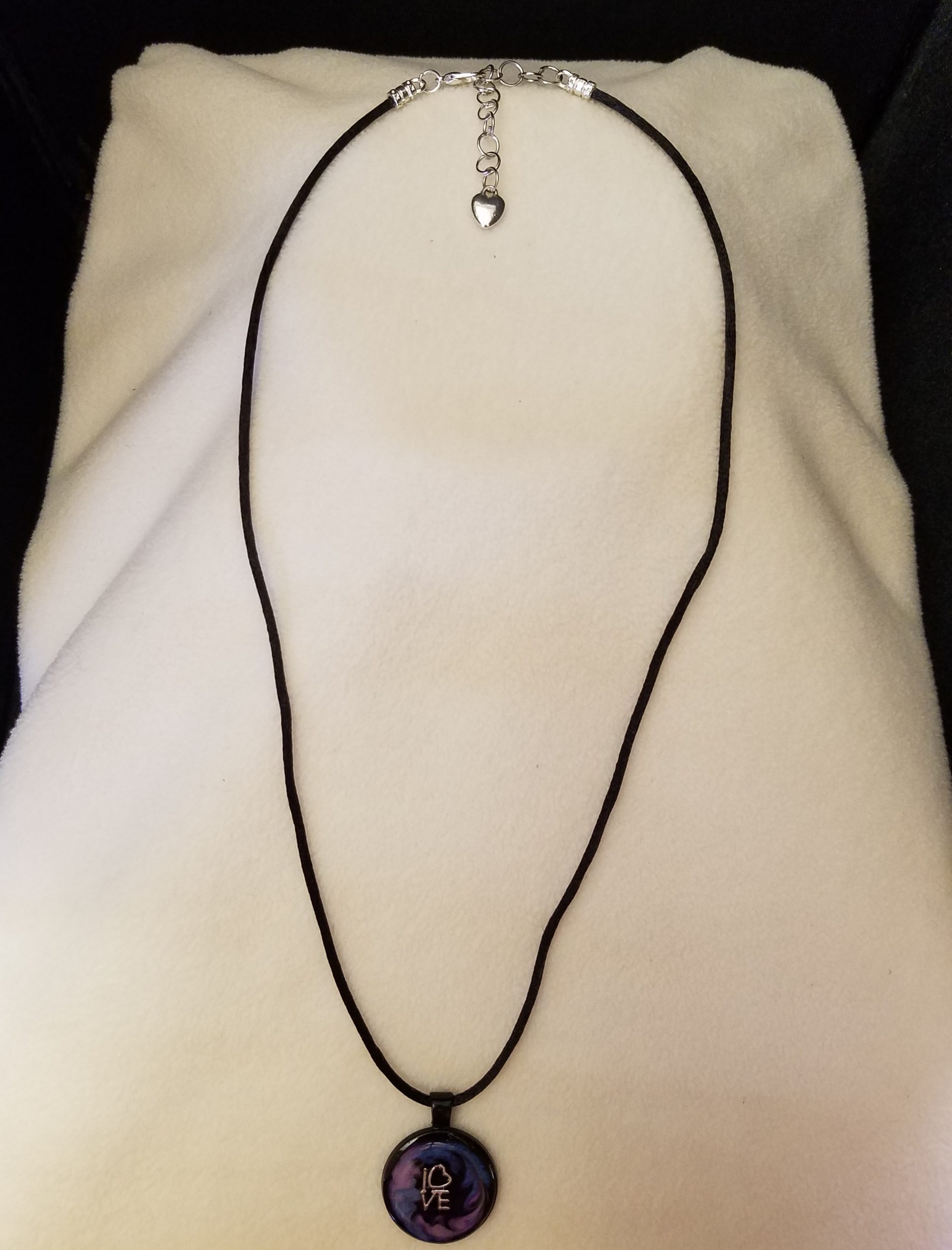 Adjustable Black Cord Necklace with a Silver 'LOVE' Charm in Purple & Blue Swirl Epoxy on Round Black Pendant