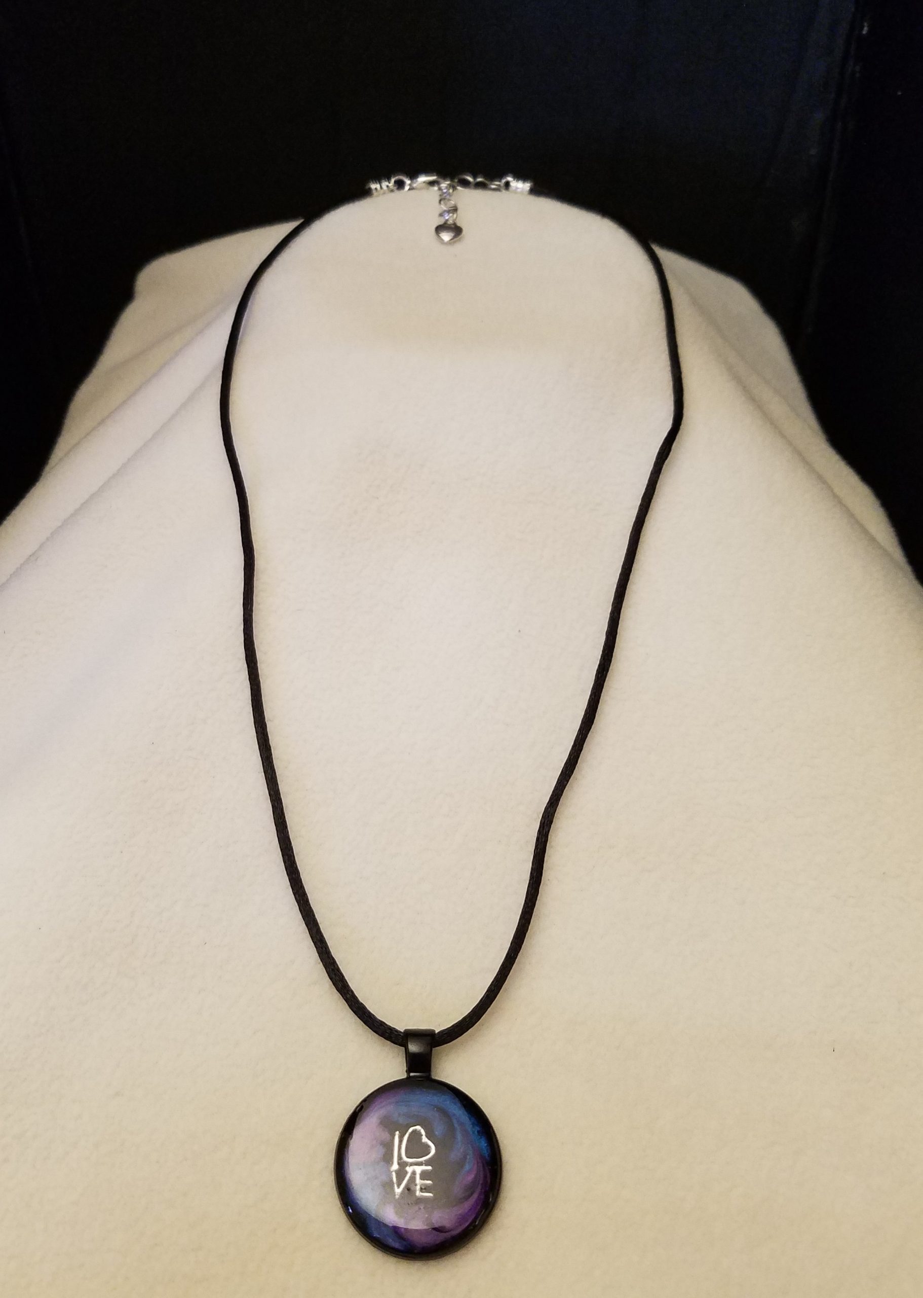 Adjustable Black Cord Necklace with a Silver 'LOVE' Charm in Purple & Blue Swirl Epoxy on Round Black Pendant