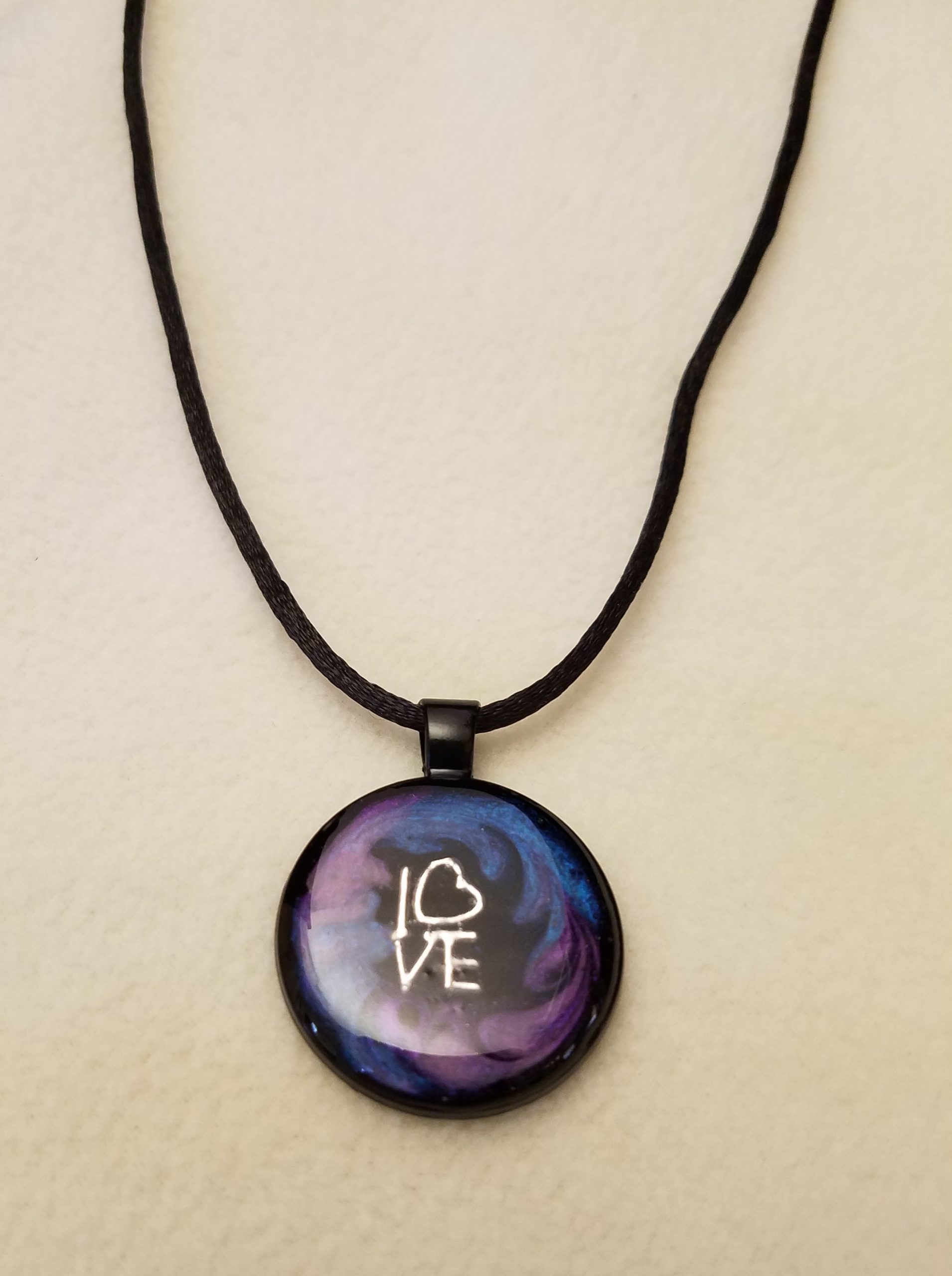 Silver 'LOVE' Charm in Purple & Blue Swirl Epoxy on Round Black Pendant on Black Cord Necklace