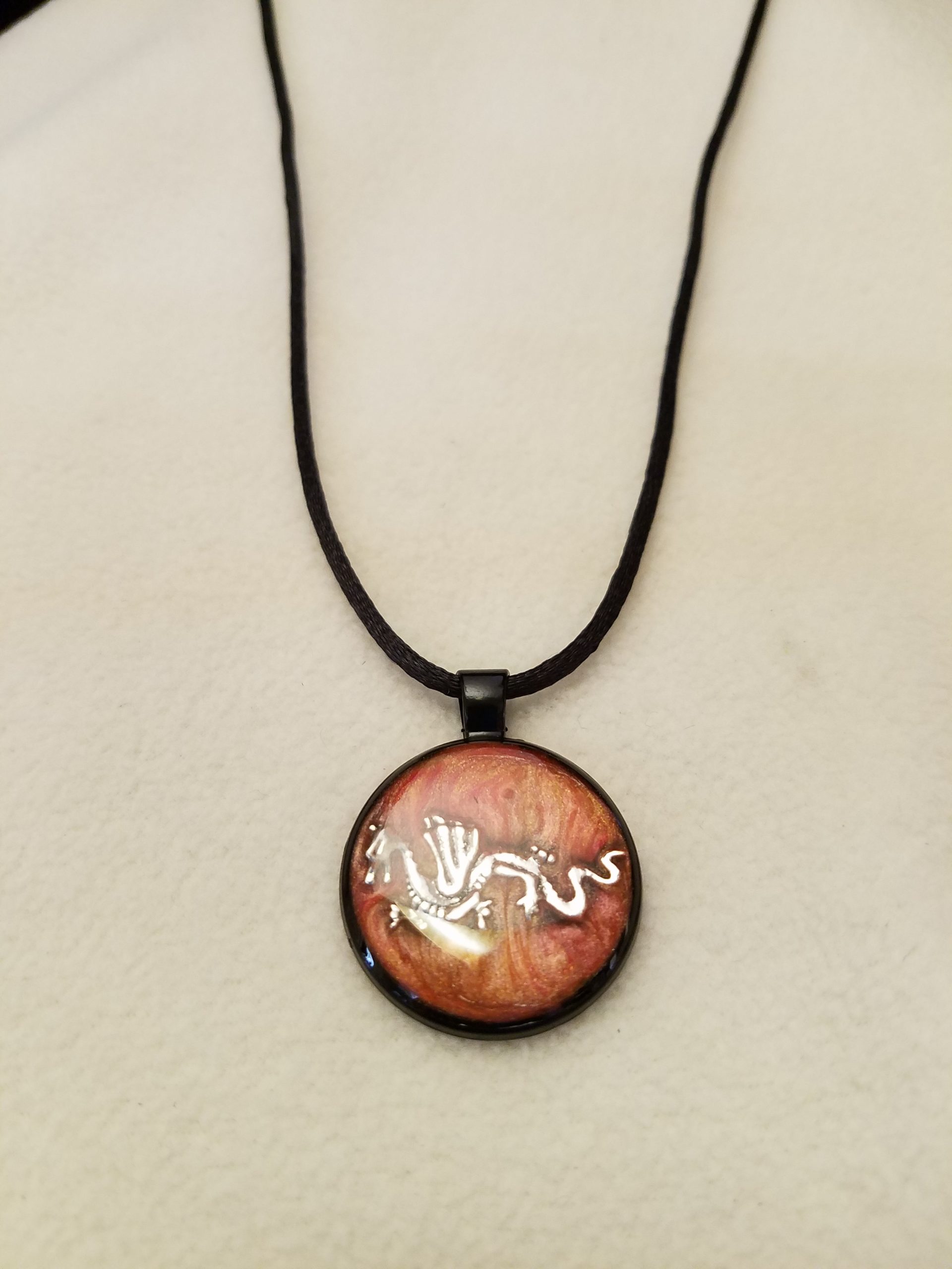 Orange Swirl Epoxy Silver Dragon Round Black Pendant