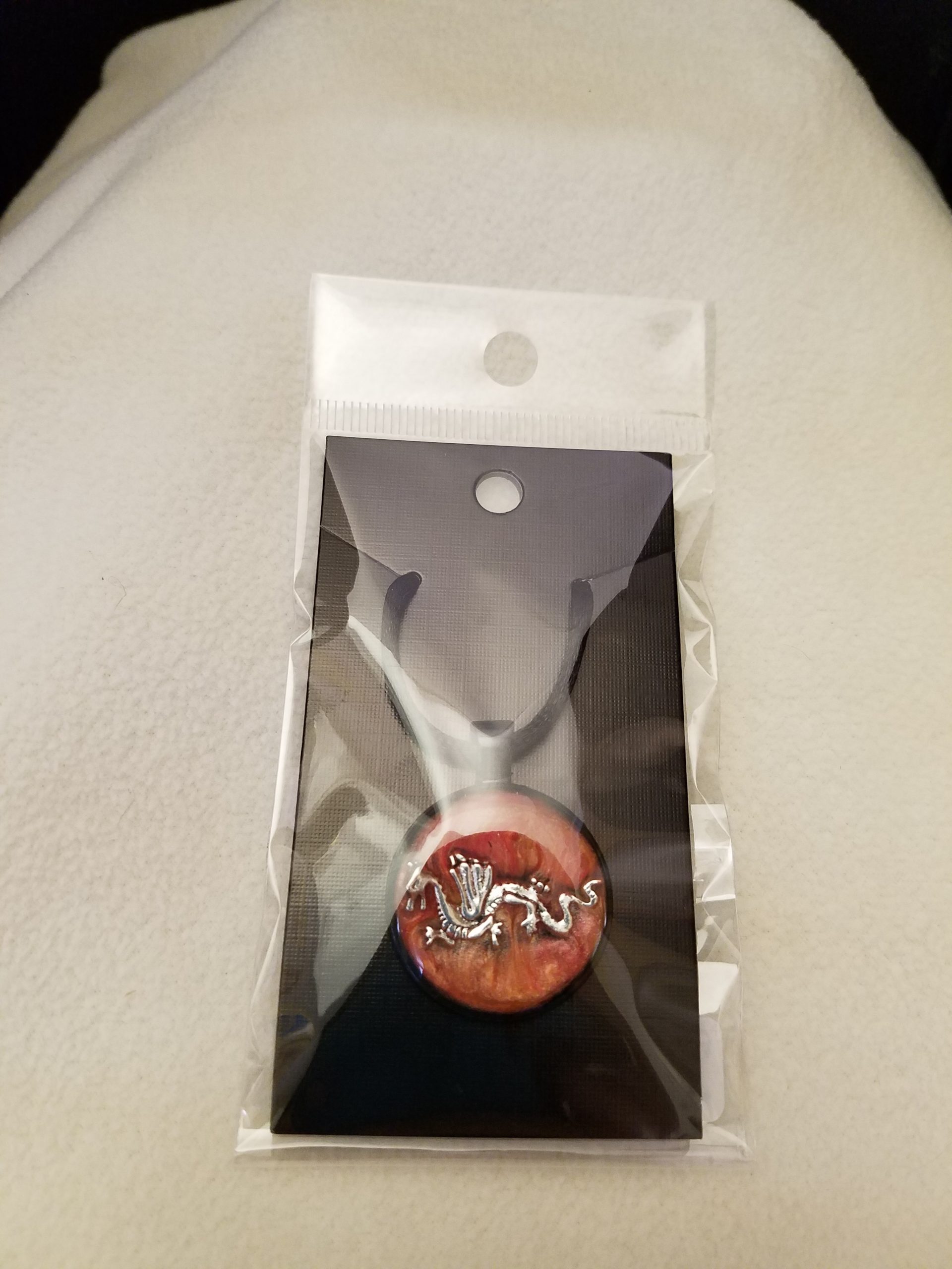 Adjustable Knotted Black Cord Necklace with Orange Swirl Epoxy Silver Dragon Round Black Pendant