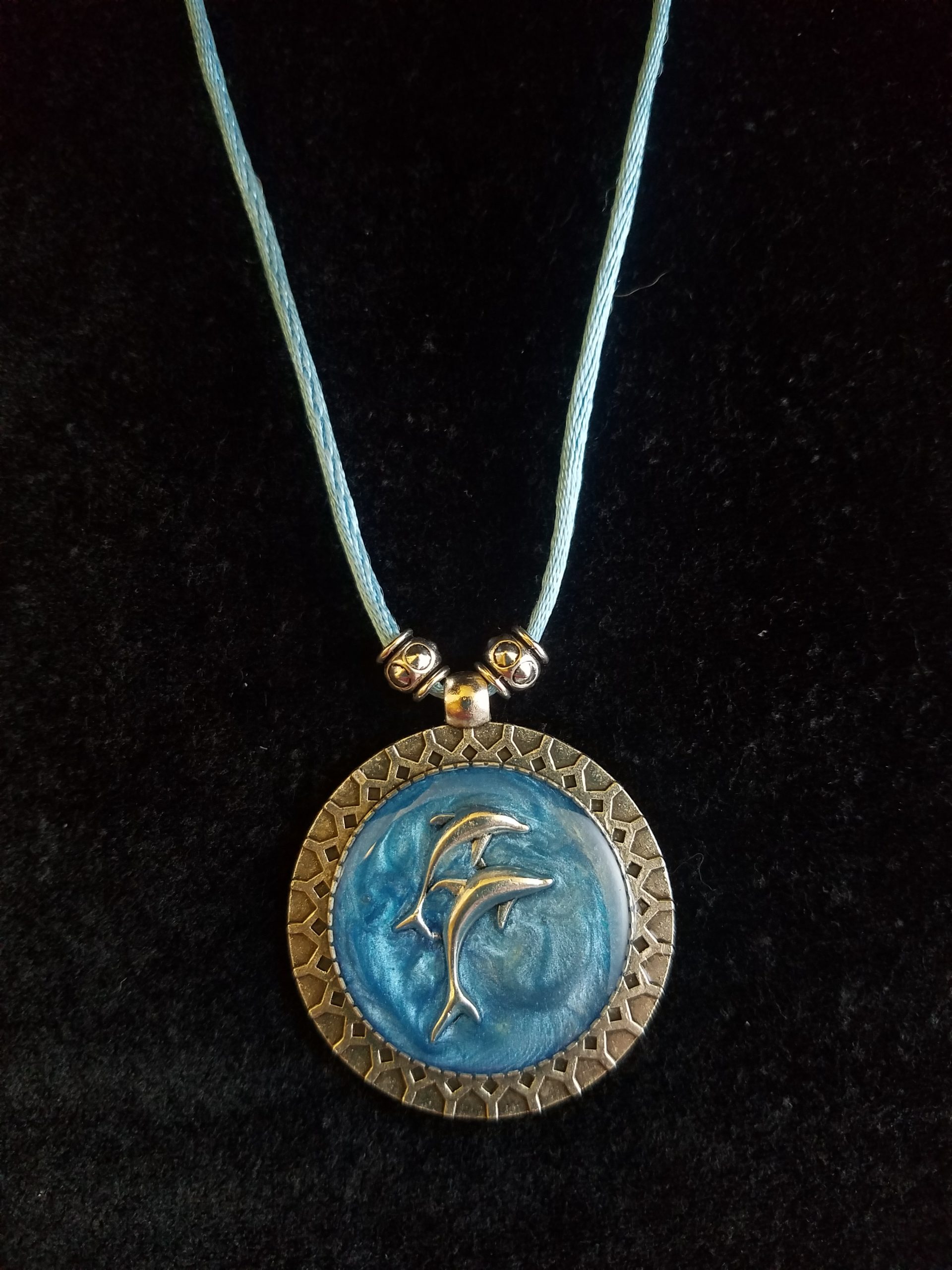 Silver Dolphins Set in Blue Epoxy on Decorative Silver Pendant on Beaded Blue Cord Necklace
