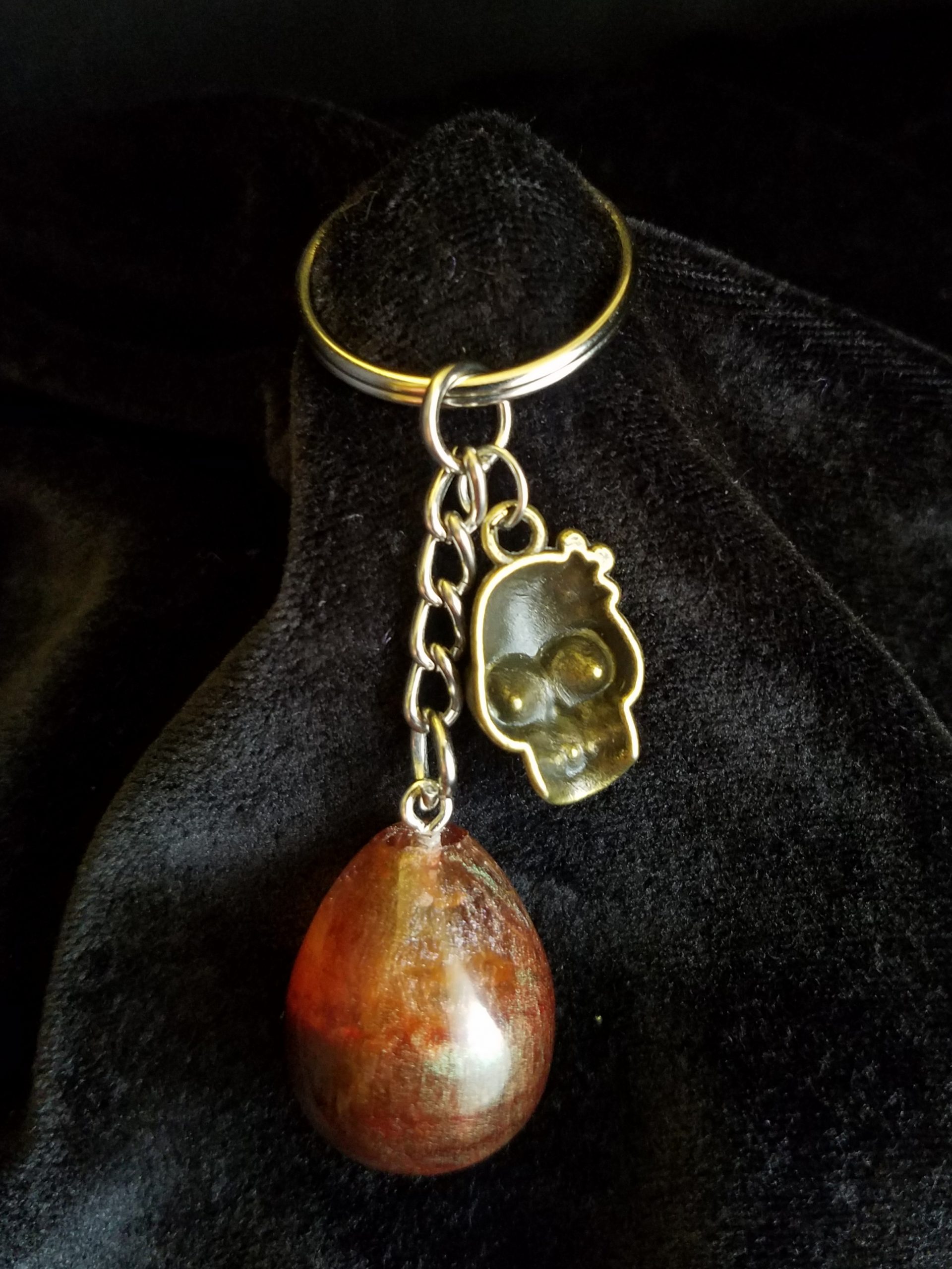 Abstract Brown & Clear Egg Keychain with Bronze Girl Skull Charm