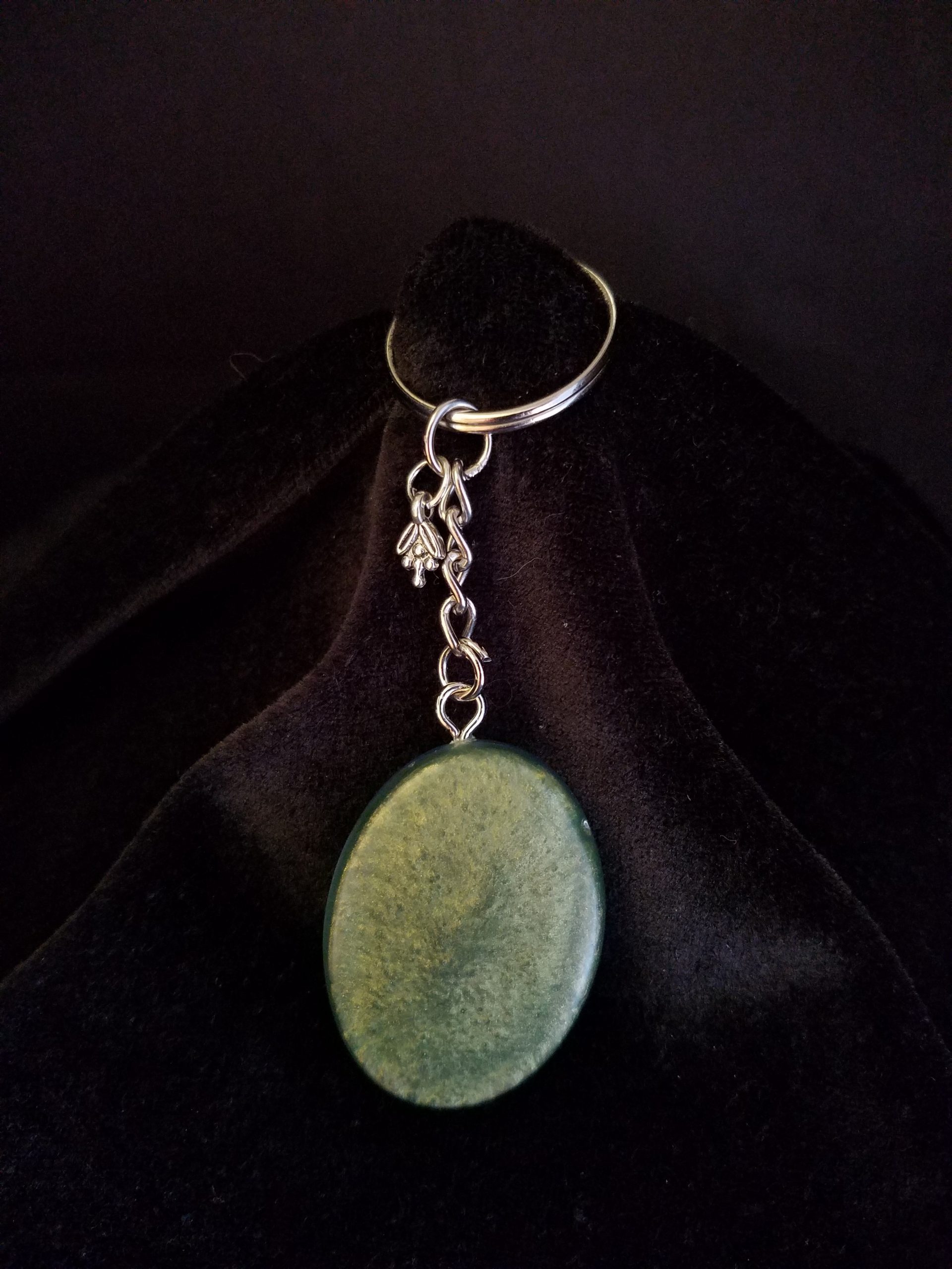 Oval Pendant Keychain Filled with Blue Flower Bouquet in Clear Glitter and Green Epoxy with Silver Flower Charm