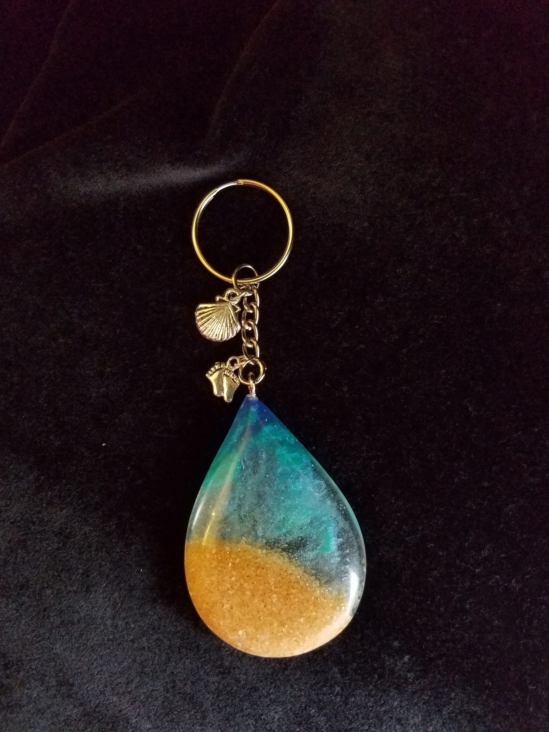 Beach Theme Teardrop Pendant Keychain Filled with Brown Glitter Sand, Triple Blue & Clear Epoxy with Silver Seashell & Feet Charms