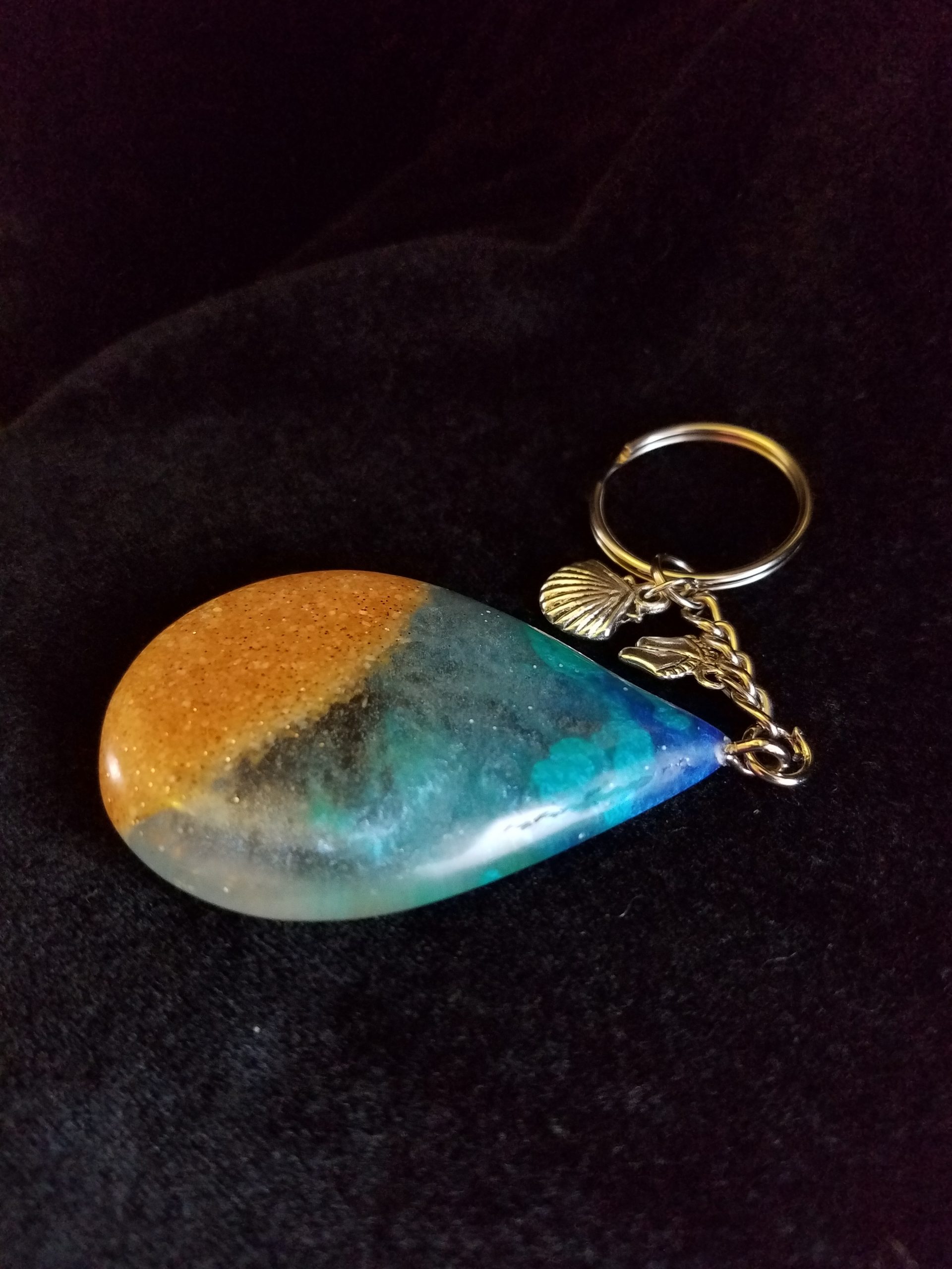 Beach Theme Teardrop Pendant Keychain Filled with Brown Glitter Sand, Triple Blue & Clear Epoxy with Silver Seashell & Feet Charms