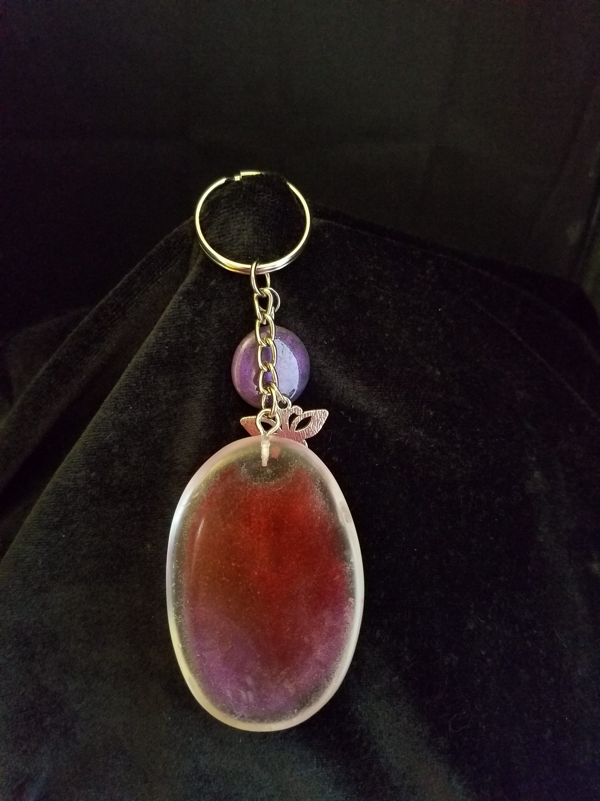 Abstract Clear Purple & Red Shimmery Oval Epoxy Pendant Keychain with Butterfly