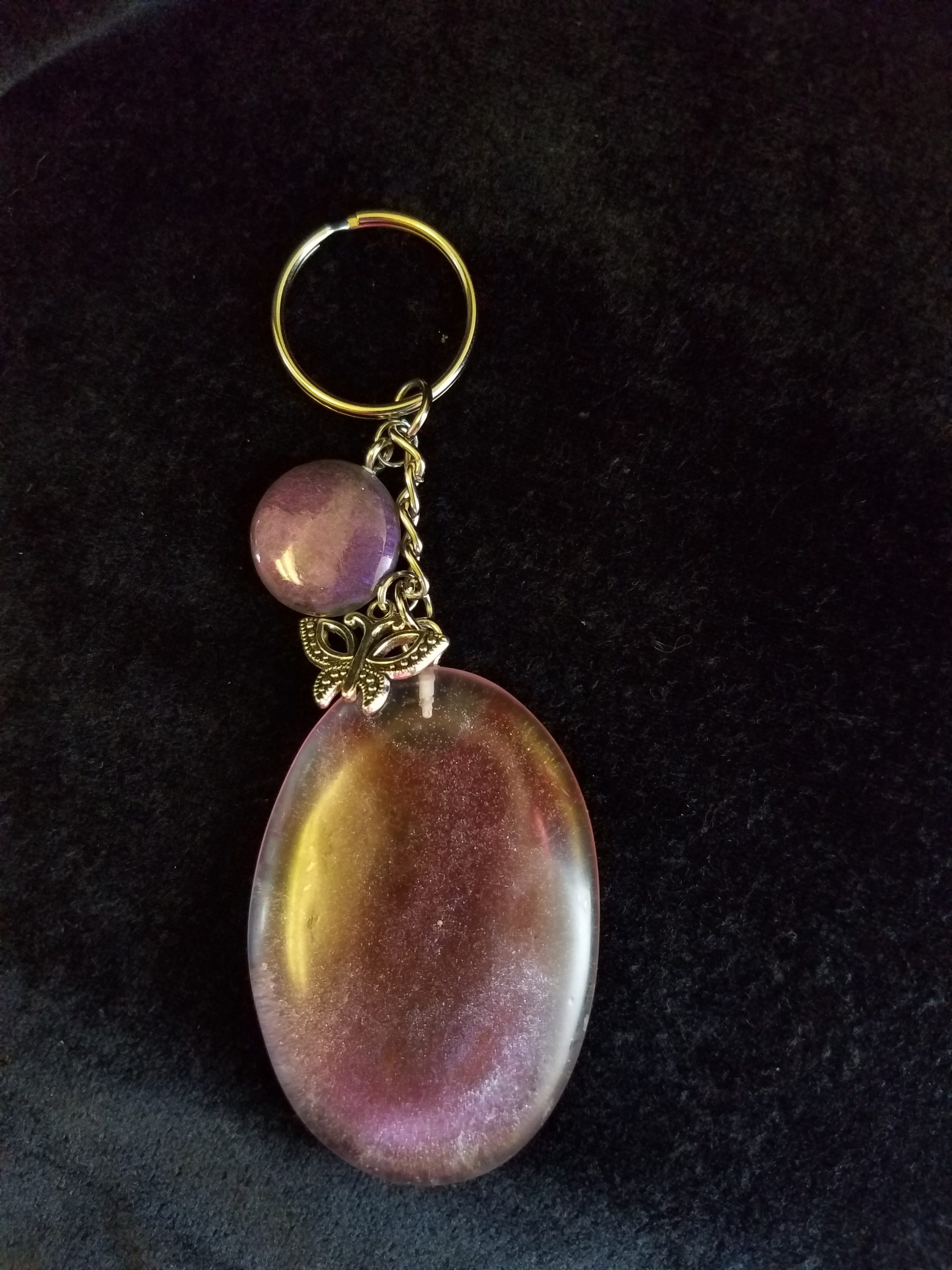 Abstract Clear Purple & Red Shimmery Oval Epoxy Pendant Keychain with Butterfly