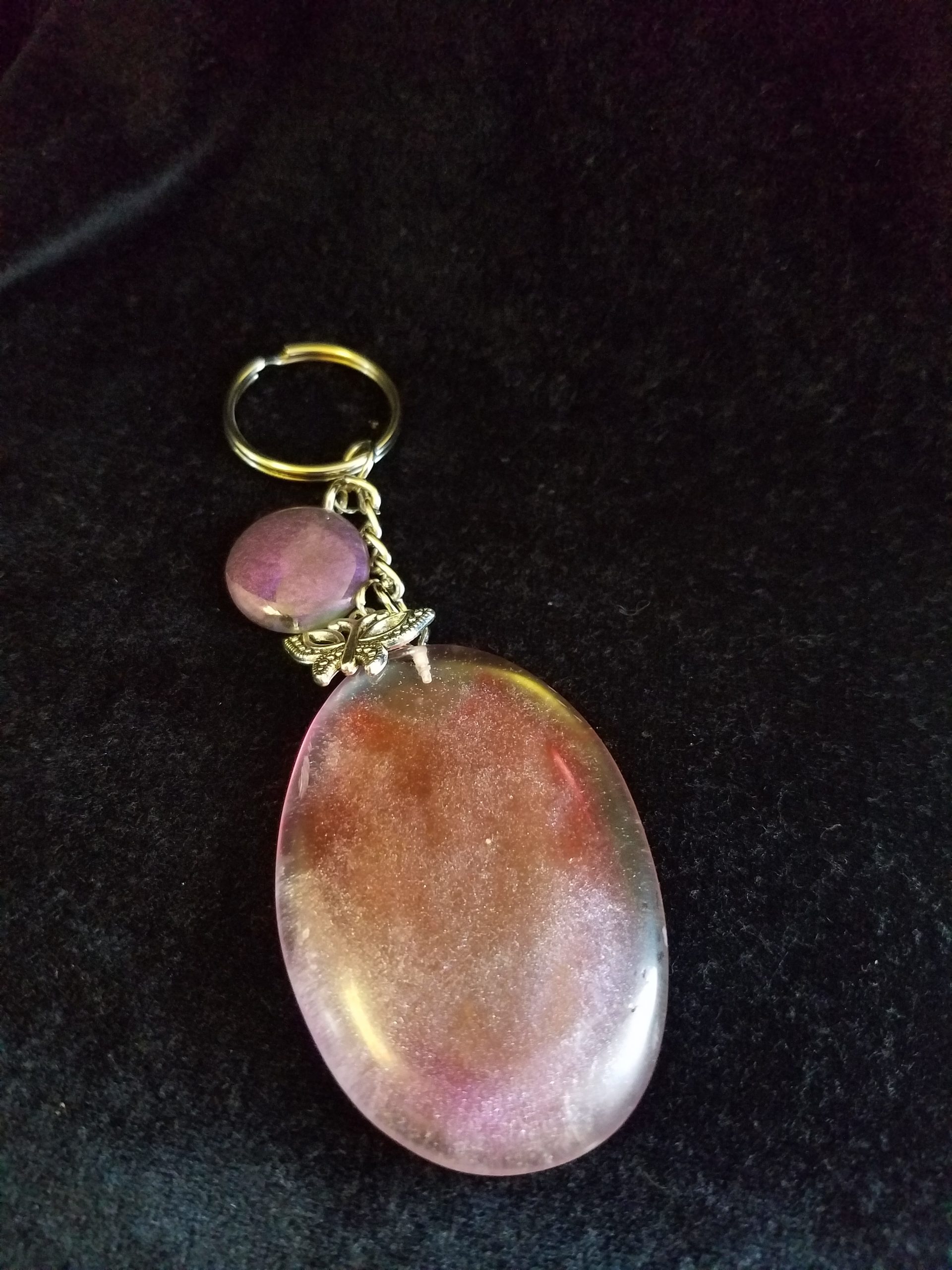 Abstract Clear Purple & Red Shimmery Oval Epoxy Pendant Keychain with Butterfly