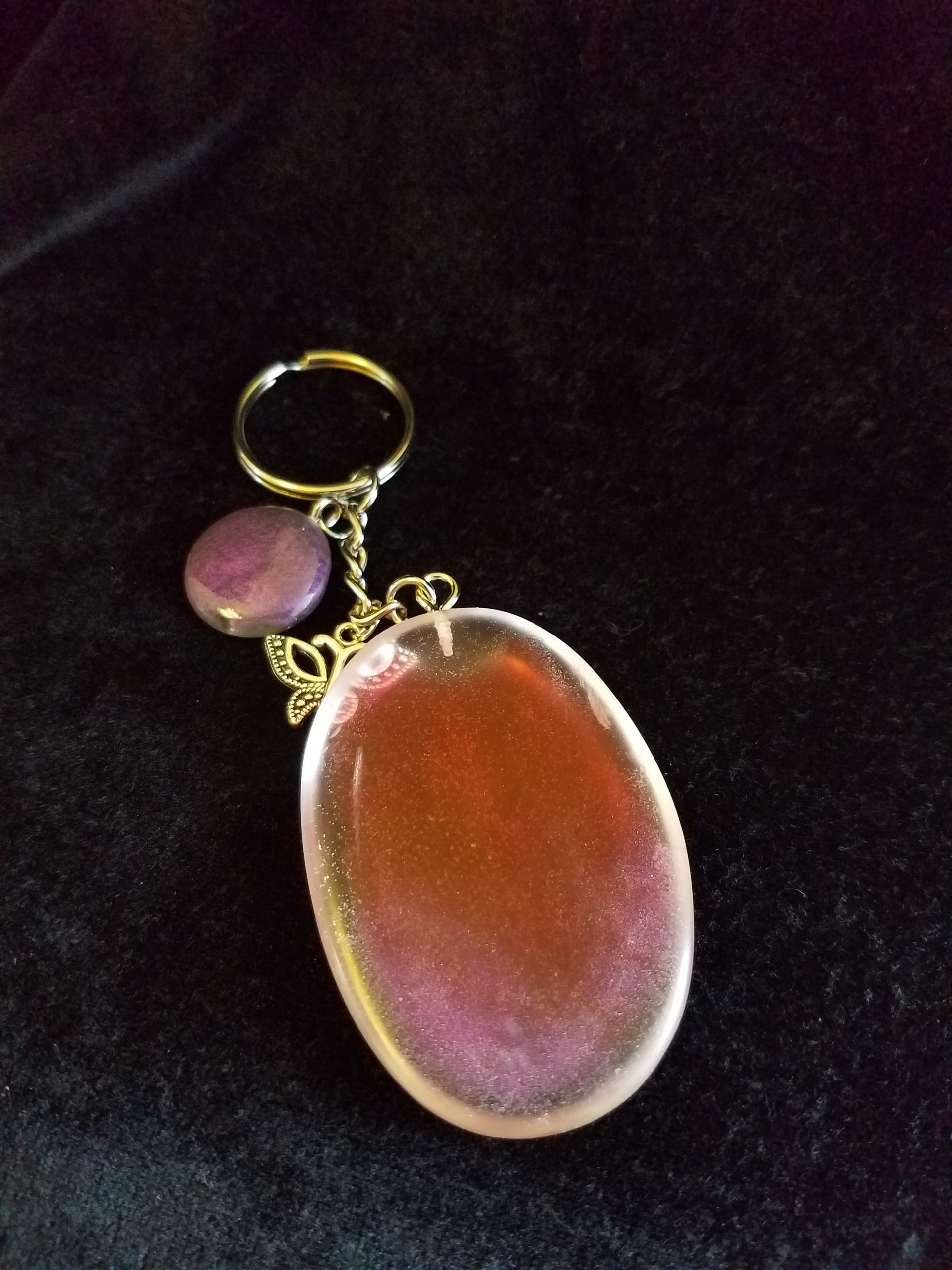 Abstract Clear Purple & Red Shimmery Oval Epoxy Pendant Keychain with Butterfly