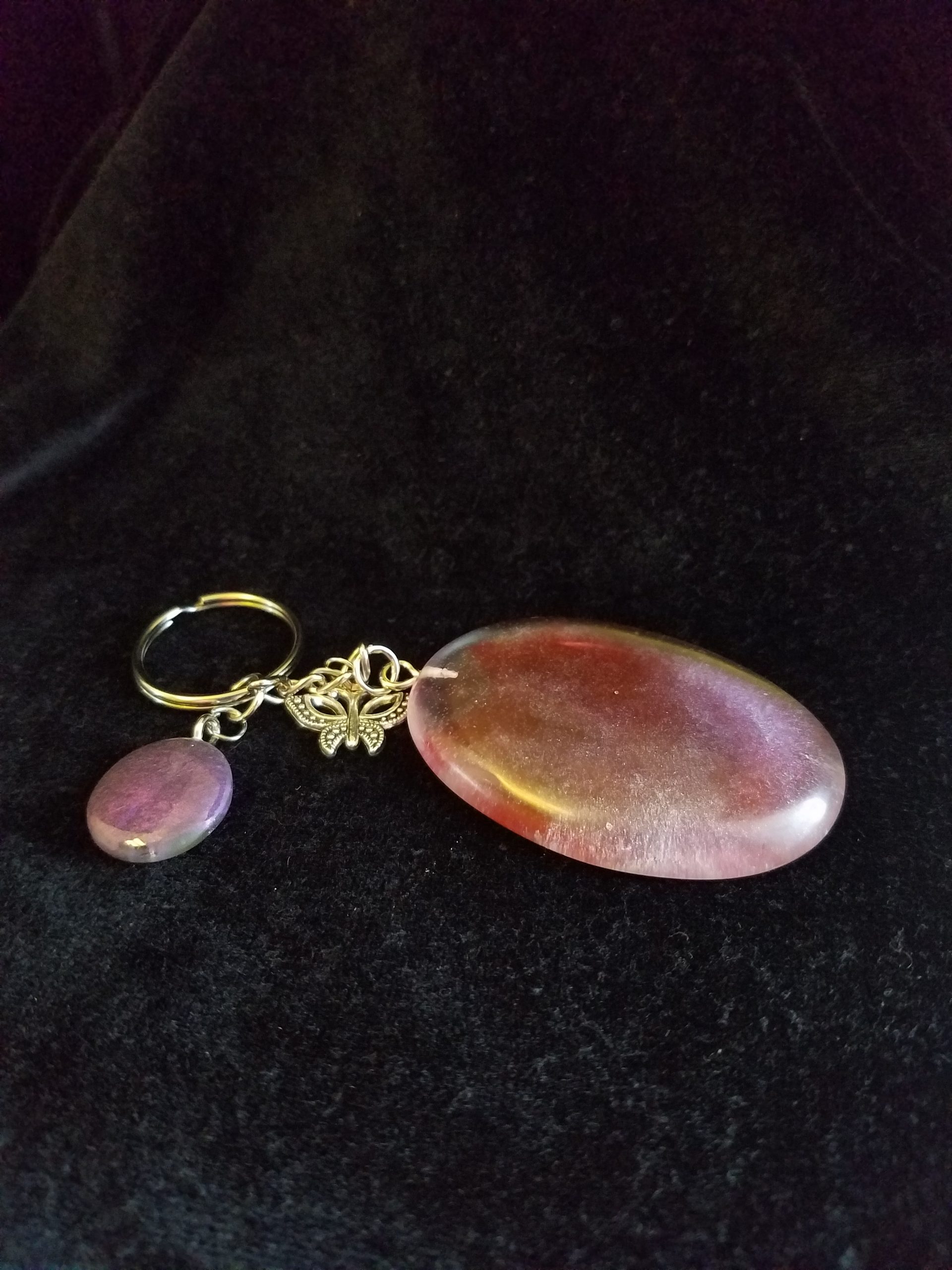 Abstract Clear Purple & Red Shimmery Oval Epoxy Pendant Keychain with Butterfly