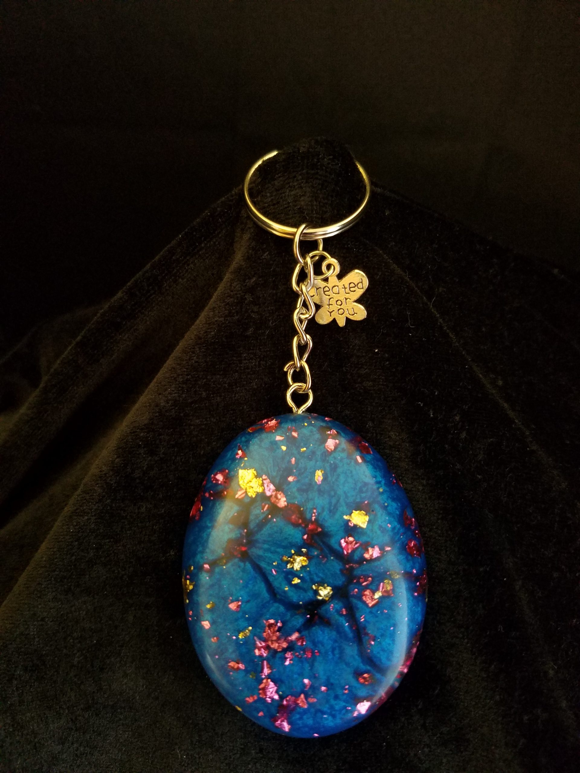 Abstract Shimmery Blue Oval Epoxy Pendant Keychain with Gold & Pink Foil Flakes & Silver Butterfly Charm
