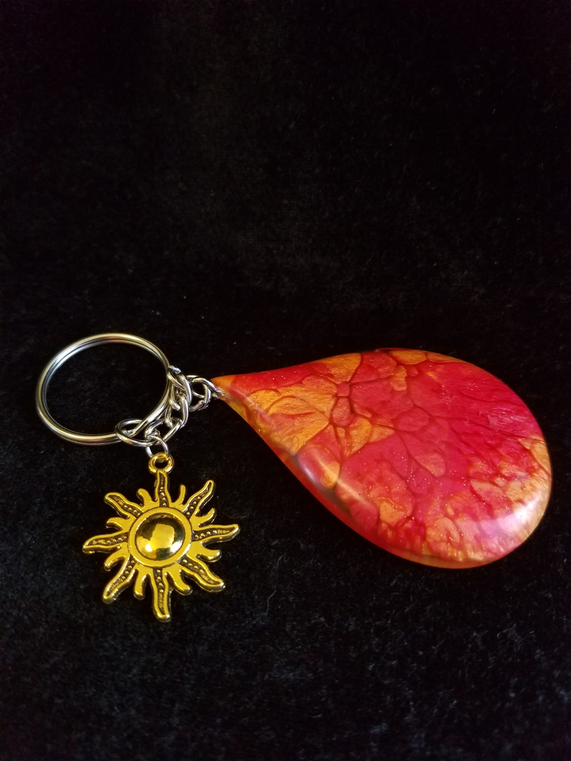 Abstract Red, Orange & Yellow Fire Swirl Teardrop Epoxy Pendant Keychain With Gold Sun Charm