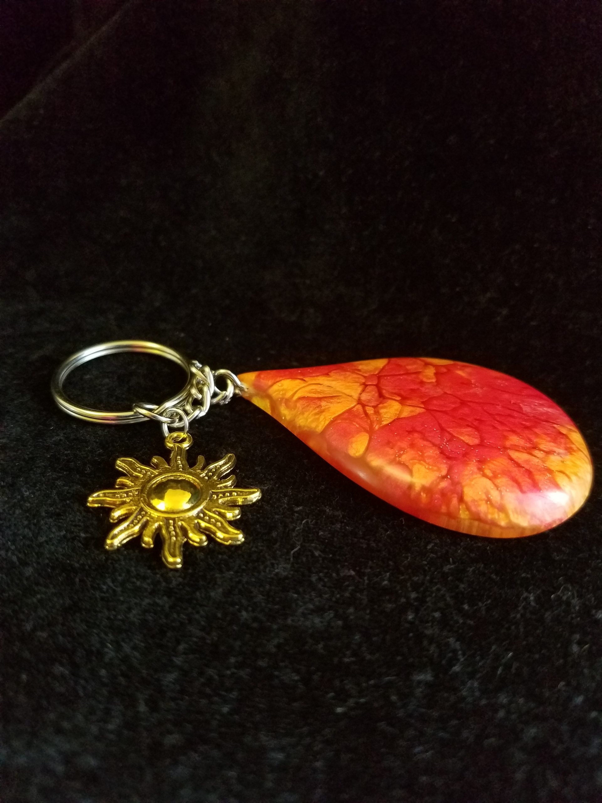 Abstract Red, Orange & Yellow Fire Swirl Teardrop Epoxy Pendant Keychain With Gold Sun Charm