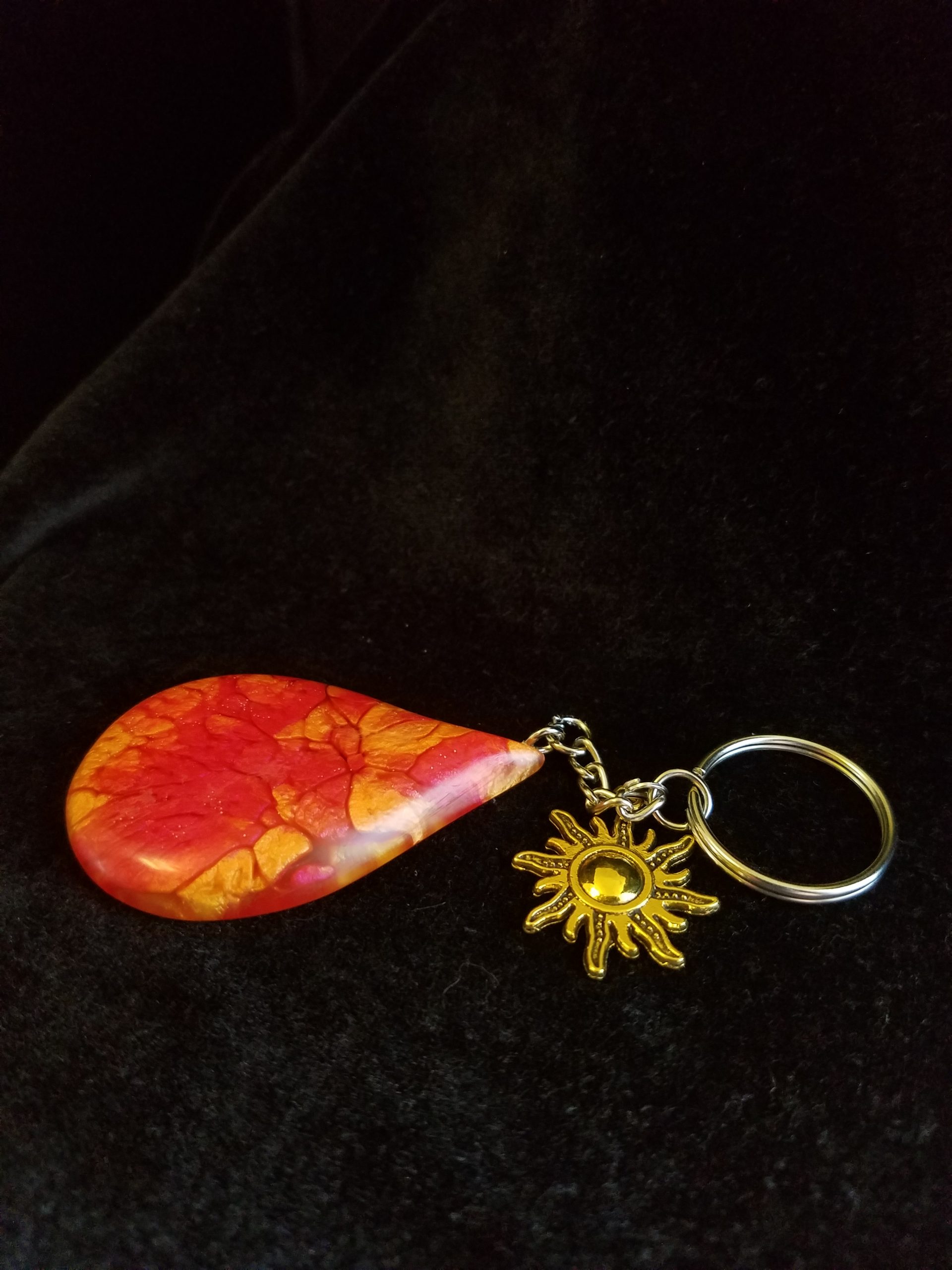 Abstract Red, Orange & Yellow Fire Swirl Teardrop Epoxy Pendant Keychain With Gold Sun Charm