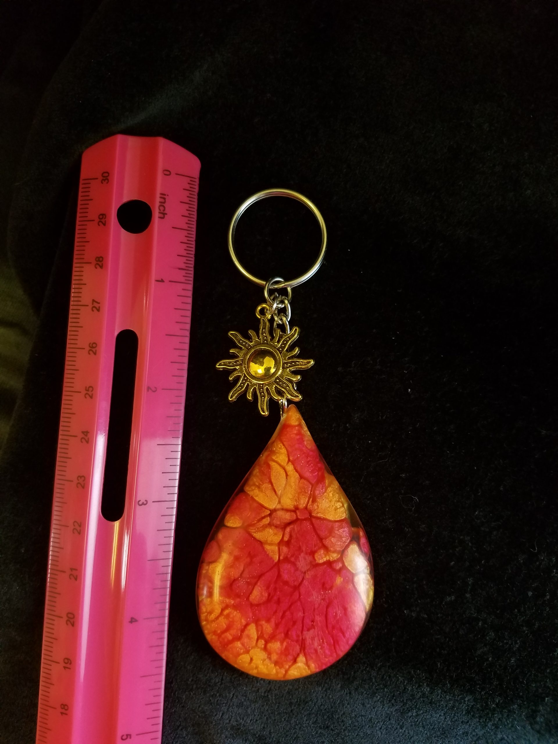 Abstract Red, Orange & Yellow Fire Swirl Teardrop Epoxy Pendant Keychain With Gold Sun Charm