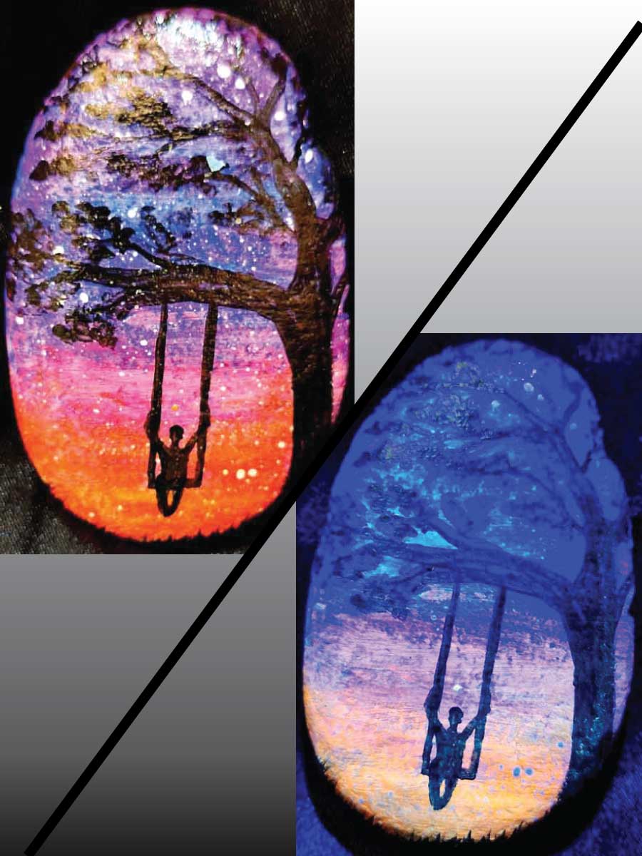 alt="Collage view with 2 images of a hand painted in acrylic paint 2.5 by 3 inch smooth oval rock with a neon orange, pink, purple and blue blended sunset in the background with a black silhouette in the foreground containing an image of a country scene with a tall thick branchy leafy tree on the right side and framing over the top of the rock with a person swinging on a swing hanging from a branch and grass at the bottom of the rock, one viewed in regular light and one viewed under black light.">