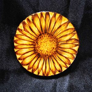 alt="Small 2.5 inch by 2.5 inch round wood slice magnet designed with hand burned sunflower artwork.">