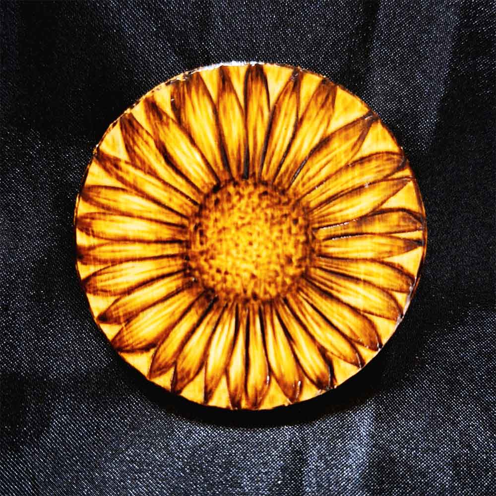 alt="Small 2.5 inch by 2.5 inch round wood slice magnet designed with hand burned sunflower artwork.">