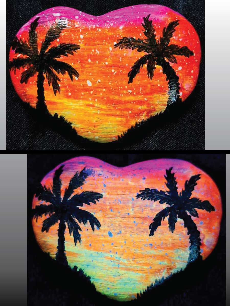 alt="Collage view with 2 images of a hand painted in acrylic paint 3 by 2 inch smooth heart shaped rock with a neon yellow orange and pink blended sunset in the background with a black silhouette image of 2 tropical palm trees and grass framing the left and right sides of the rock in the foreground, one viewed in regular light and one viewed under black light.">